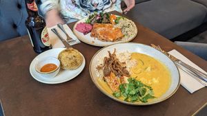 Yellow curry with lasagna and arancini ball at Nordvegan in Oslo