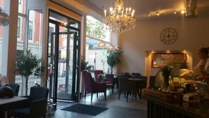 The interior. With a fancy chandelier. at Nordvegan in Oslo