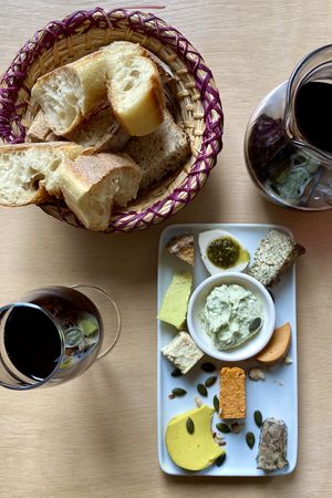 cheese plate and wine at Le Faitout Vegan in Paris