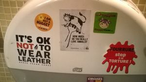 Animal right stickers in the bathroom at Le Faitout Vegan in Paris