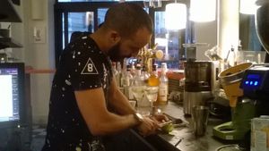 The nice waiter prepares a cocktail at Le Faitout Vegan in Paris