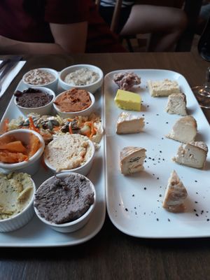 Cheese plate & various tapas (hummus, kimchi, tapenade, etc.) at Le Faitout Vegan in Paris