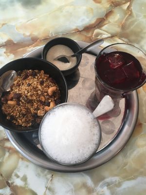 Breakfast: granola, coffee and juice  at Le Faitout Vegan in Paris