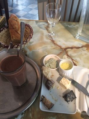 To die for cheese plate, baguette and chocolat chaud. at Le Faitout Vegan in Paris