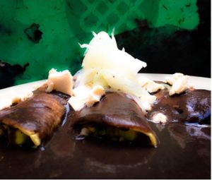 Enveganadas de frijol rellenas de calabaza con elote y cebolla ¡deliciosas! at Aura Vegana in Mexico City