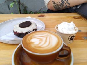 Donut, coffee, puppy drink. at Full Circle - Zuid in Ghent
