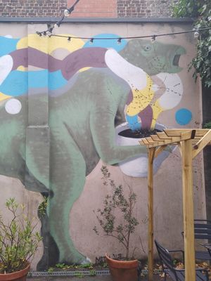 Iguanodon with a coffee. at Full Circle - Zuid in Ghent