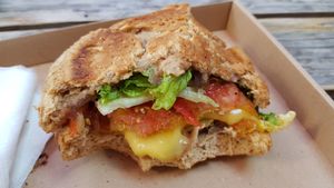 Coated vegan cheese burger had lovely melty "cheese" inside. Yum! at Las Vegan's - Kazinczy Trailer in Budapest