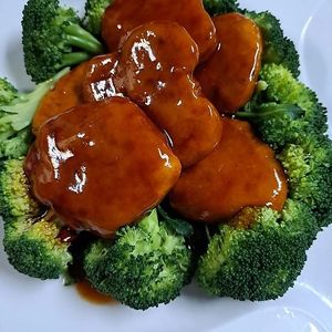 Breaded Medallions of Sauteed Soy Protein with steam Broccoli in a Spicy Sauce at Ginger Root in New York City