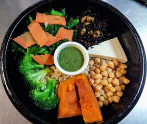Steamed pumpkin, chick peas, kale, black seaweed, broccoli, carrot and tofu on a bed of brown rice. at Ginger Root in New York City