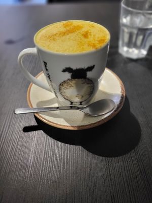 Turmeric Latte (oat milk) and Pulled Jackfruit Burger at Holy Cow in Edinburgh