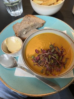 Carrot and coriander soup and homemade buckwheat bread  at Holy Cow in Edinburgh
