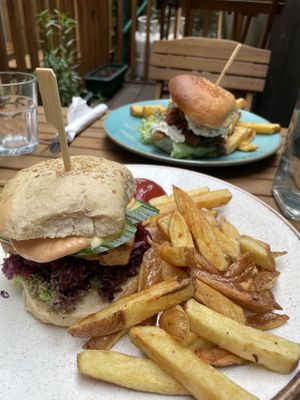 in the front the vietnamese style tofu burger and in the back oyster mushroom burger   at Holy Cow in Edinburgh