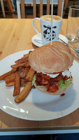 Pulled Jackfruit burger with chips and an oat milk latte   at Holy Cow in Edinburgh
