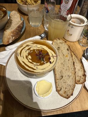 Pumpkin soup with sourdough bread  at Holy Cow in Edinburgh
