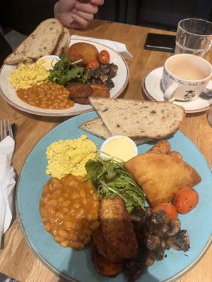 Full vegan breakfast (sausages, tofu scramble, seitan bacon, mushrooms, beans, tomatoes, tattie scone, toast with butter)  at Holy Cow in Edinburgh
