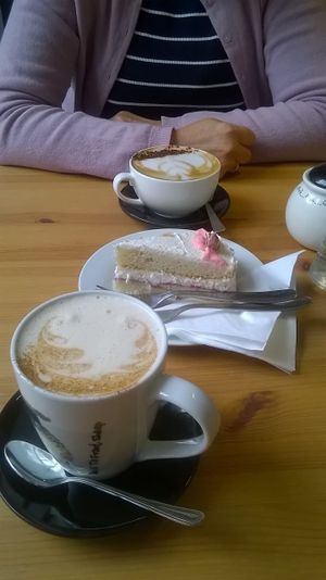 Chai latte, almond cappuccino and vanilla velvet cake at Holy Cow in Edinburgh
