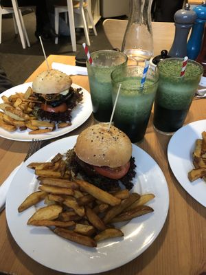 “Fish” burger and BBQ burger with green smoothies  at Holy Cow in Edinburgh