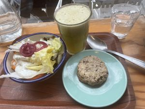 Small bowl (I’ve forgotten the name of it) , juice and cookie   at So Nat - Bourdaloue in Paris