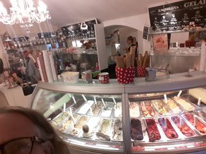 The ice-creams the red labels are vegan Please do not mind the head :) at Creme de la Creme in Prague