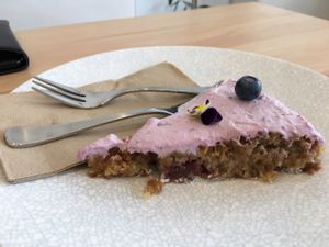 raspberry cream topped gluten free cake  at The Origin in Christchurch