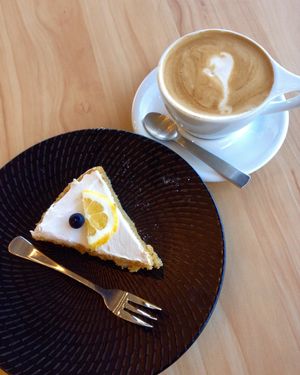Lemon cake and coconut milk coffee at The Origin in Christchurch