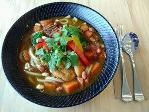 "Papa's Spice Noodle Soup" - Fresh noodles, carrots, shiitake mushrooms, soy beans, soy protein, tomatoes, peanuts & coriander for $19 at The Origin in Christchurch