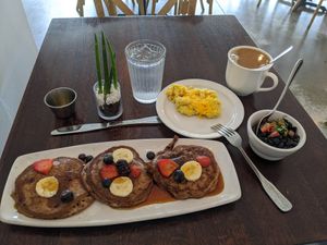 Flapjacks and coffee with sides of "eggs" and black beans. Delicious! at Citizen Eatery in Austin