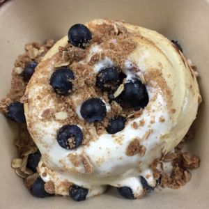vanilla frosting with blueberries and pie crumble toppings!!! at Cinnaholic in Brea