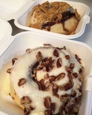 Maple glazed with pecans and maple glazed with crushed graham crackers  at Cinnaholic in Brea