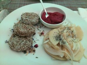 RAW. Dried fruit and vegetables burger/ beetroot hummus / apple and fennel salad at Un'Altra Idea in Bologna