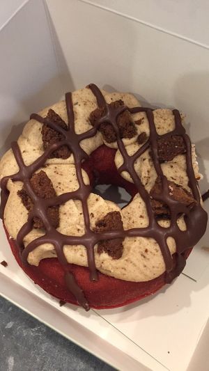 Red velvet donut with a cookie creme topping and some choc brownie bites  at Doughnut Time - QVB in Sydney
