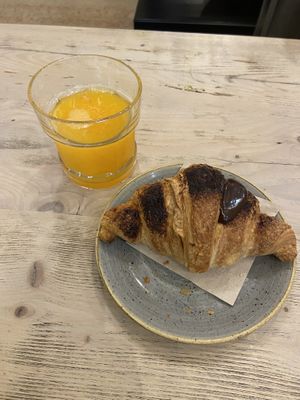 Vegan chocolate croissant and orange juice  at Pappare' in Bologna