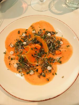 Very thinly sliced beets with micro-green and sea buckthorn salad on top at Vaxthuset in Stockholm