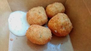 Potatoes fritters and sauce at Season Square in Paris