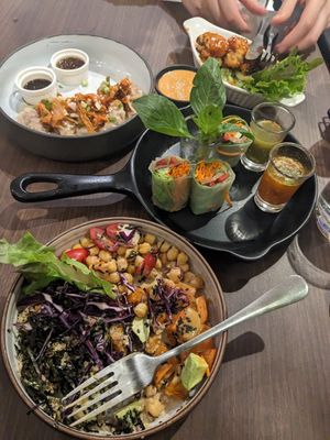 Kimchi dumplings, sweet potato quinoa bowl, b*con spring rolls, cauliflower wings at Veganerie - Siam Paragon in Bangkok