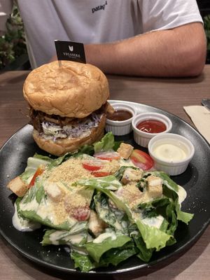 Pulled pork burger with Caesar salad. They were out of fries which are the standard side to a burger.   at Veganerie - Siam Paragon in Bangkok