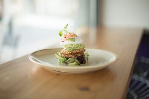 Chickpea Patty with smashed avocado and poached egg at The Hidden Olive in Plymouth