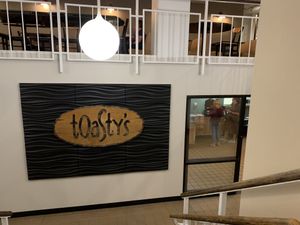 Sign at front entrance (inside the mini mall area)  at Toasty's Grilled Cheese Shop in Duluth
