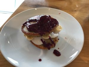 Pancakes with coconut yogurt and fruit sauce at Ahimsa The Vegan Cafe in North West London