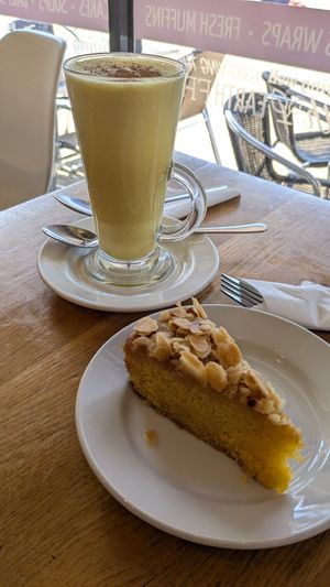 Polenta cake and turmeric latte at Ahimsa The Vegan Cafe in North West London