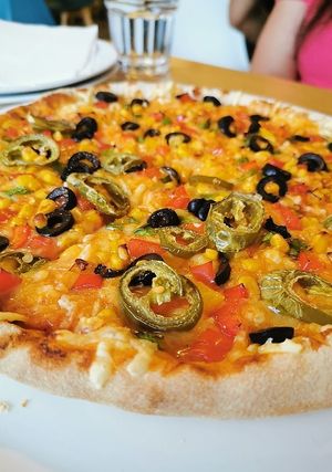 Half and half pizza at Ahimsa The Vegan Cafe in North West London