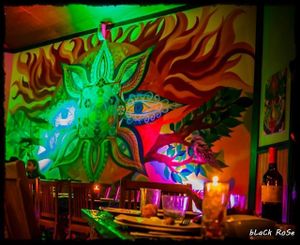 The large mural on the wall of the restaurant. at Paradise One Retreat in Coorabell