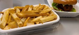 Poutine. Not enough cheese but the mushroom sauce was great. at LOV - McGill in Montreal