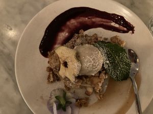 Apple crumble with ice cream, garnished with blackberry puree, apple chip, mint leaf  at LOV - McGill in Montreal