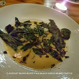 flageolet beans soup with crispy black kale, black garlic, black truffle at Avelo in Toronto