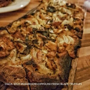 Wild mushroom flatbread with cippolini and black truffles  at Avelo in Toronto