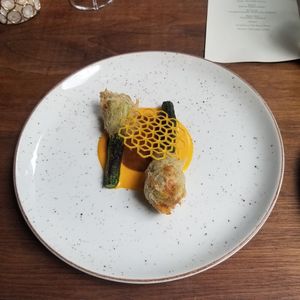 Walnut and seabuckthorn reduction, mini zucchini wrapped in fried sourdough at Avelo in Toronto