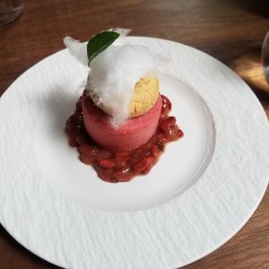 Dessert, strawberry, goji berry, pecan, with a rum reduction, topped with cotton candy at Avelo in Toronto