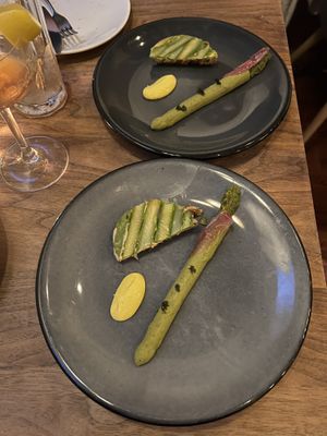 Asparagus tart, trompe l’oeil basil mousse “asparagus” with gremolata  at Avelo in Toronto